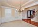 Bright dining room with chandelier and hardwood floors at 5539 Halsey Trce, Atlanta, GA 30349