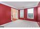 Entryway with red walls and view of the staircase at 5539 Halsey Trce, Atlanta, GA 30349