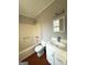 Bathroom with tub, toilet and white vanity at 3203 Pawnee Dr, Rex, GA 30273