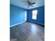 Spacious bedroom with ceiling fan and grey laminate flooring at 3203 Pawnee Dr, Rex, GA 30273