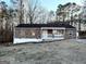 Ranch style home with stone accents and a covered porch at 3203 Pawnee Dr, Rex, GA 30273