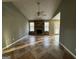 Vaulted ceiling living room with a stone fireplace at 3203 Pawnee Dr, Rex, GA 30273