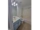 Bathroom with light blue vanity and tub at 1345 Pinebreeze Way, Marietta, GA 30062