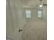 Spacious bedroom with carpet, ceiling fan, and large windows at 1345 Pinebreeze Way, Marietta, GA 30062