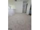 Upstairs hallway with gray carpet and access to bedrooms at 1345 Pinebreeze Way, Marietta, GA 30062