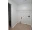 Laundry room with tile floor and wire shelving at 1345 Pinebreeze Way, Marietta, GA 30062