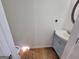 Small powder room with light blue vanity at 1345 Pinebreeze Way, Marietta, GA 30062