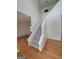 Staircase with gray carpeting and hardwood floors at 1345 Pinebreeze Way, Marietta, GA 30062