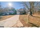 Charming two-story home featuring a well-maintained lawn and long driveway on a sunny day at 1129 Winston Dr, Decatur, GA 30032
