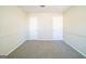 Bedroom showcases two white doors, neutral walls with trim, and neutral carpet providing a calming and serene retreat at 1129 Winston Dr, Decatur, GA 30032