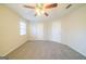 Large bedroom with carpet, ceiling fan, and two closets at 1129 Winston Dr, Decatur, GA 30032