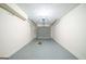 A clean, unfinished garage with a garage door and white walls at 1129 Winston Dr, Decatur, GA 30032