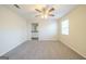 Bright bedroom with ceiling fan, carpet, and access to a bathroom at 1129 Winston Dr, Decatur, GA 30032