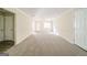 Large carpeted living room with ceiling fan and natural light at 1129 Winston Dr, Decatur, GA 30032