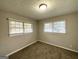 Spacious bedroom with neutral walls and carpet flooring at 1884 Derrill Dr, Decatur, GA 30032