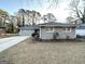 Newly painted gray ranch home with a spacious lawn at 1884 Derrill Dr, Decatur, GA 30032