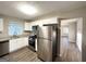 Modern kitchen with stainless steel appliances and white cabinets at 1884 Derrill Dr, Decatur, GA 30032