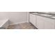 A bathroom featuring a double vanity, gray countertop, and tiled floor at 12029 Conrad Circle, Hampton, GA 30228