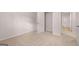 A bright bedroom with carpet and an open closet and doorway at 12029 Conrad Circle, Hampton, GA 30228