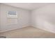 Bedroom featuring carpet, white walls, and a sunny window at 12029 Conrad Circle, Hampton, GA 30228