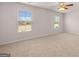 Bright bedroom with neutral walls, plush carpet, and a ceiling fan at 12029 Conrad Circle, Hampton, GA 30228