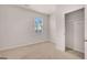 Bedroom featuring a carpeted floor, closet, and a bright window at 12029 Conrad Circle, Hampton, GA 30228