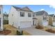 Well-maintained two-story home with a two-car garage in a residential neighborhood at 12029 Conrad Circle, Hampton, GA 30228