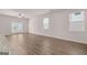 Spacious living room with hardwood flooring and large sliding doors and windows at 12029 Conrad Circle, Hampton, GA 30228