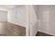 Living room area with hardwood floors and ample lighting leading to hall closet at 12029 Conrad Circle, Hampton, GA 30228