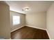 Simple bedroom with hardwood floors and neutral walls at 1996 Meadow Ln, Decatur, GA 30032