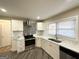 Updated kitchen with white cabinets, stylish backsplash and stainless steel appliances at 1996 Meadow Ln, Decatur, GA 30032