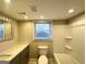 Modern bathroom with bathtub, double vanity, and window at 2629 Preston Dr, Decatur, GA 30034