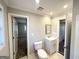 Updated bathroom with toilet, vanity, and access to other rooms at 2629 Preston Dr, Decatur, GA 30034