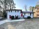 Brick ranch home with a red door and attached garage at 2629 Preston Dr, Decatur, GA 30034
