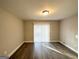 Bright living room featuring wood-look floors and sliding glass doors at 2629 Preston Dr, Decatur, GA 30034