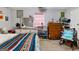 Cozy bedroom with dresser, bed, and rocking chair at 304 Slaughter Rd, Hampton, GA 30228