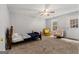 Spacious bedroom with two chairs and a bed at 304 Slaughter Rd, Hampton, GA 30228