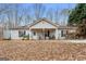 Ranch style home with covered porch and large yard at 304 Slaughter Rd, Hampton, GA 30228