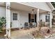 Covered front porch with seating at 304 Slaughter Rd, Hampton, GA 30228
