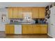 Kitchen boasts light wood cabinets, granite countertops and stainless steel dishwasher at 304 Slaughter Rd, Hampton, GA 30228