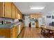 Kitchen features ample wood cabinets, granite countertops and a white stove at 304 Slaughter Rd, Hampton, GA 30228