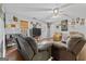 Living room with hardwood floors, comfortable seating, and a ceiling fan at 304 Slaughter Rd, Hampton, GA 30228