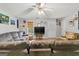 Spacious living room featuring hardwood floors, comfortable seating, and a ceiling fan at 304 Slaughter Rd, Hampton, GA 30228