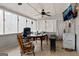 Cozy screened porch with seating and a TV at 304 Slaughter Rd, Hampton, GA 30228