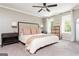 Bright main bedroom featuring neutral colors, crown molding, and two windows at 12 Independence Nw Pl # 12, Atlanta, GA 30318