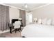 A cozy bedroom features a ceiling fan, a neutral color scheme, and a functional workspace at 12 Independence Nw Pl # 12, Atlanta, GA 30318