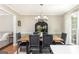 Formal dining room with a view to the living room offers space and modern aesthetic at 12 Independence Nw Pl # 12, Atlanta, GA 30318