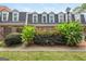 Beautiful townhome exterior with manicured landscaping, offering a picturesque and inviting curb appeal at 12 Independence Nw Pl # 12, Atlanta, GA 30318
