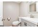 Clean and modern half bathroom featuring a stylish vanity and toilet at 12 Independence Nw Pl # 12, Atlanta, GA 30318
