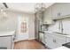 Renovated kitchen with modern appliances, subway tile backsplash, and access to backyard at 12 Independence Nw Pl # 12, Atlanta, GA 30318